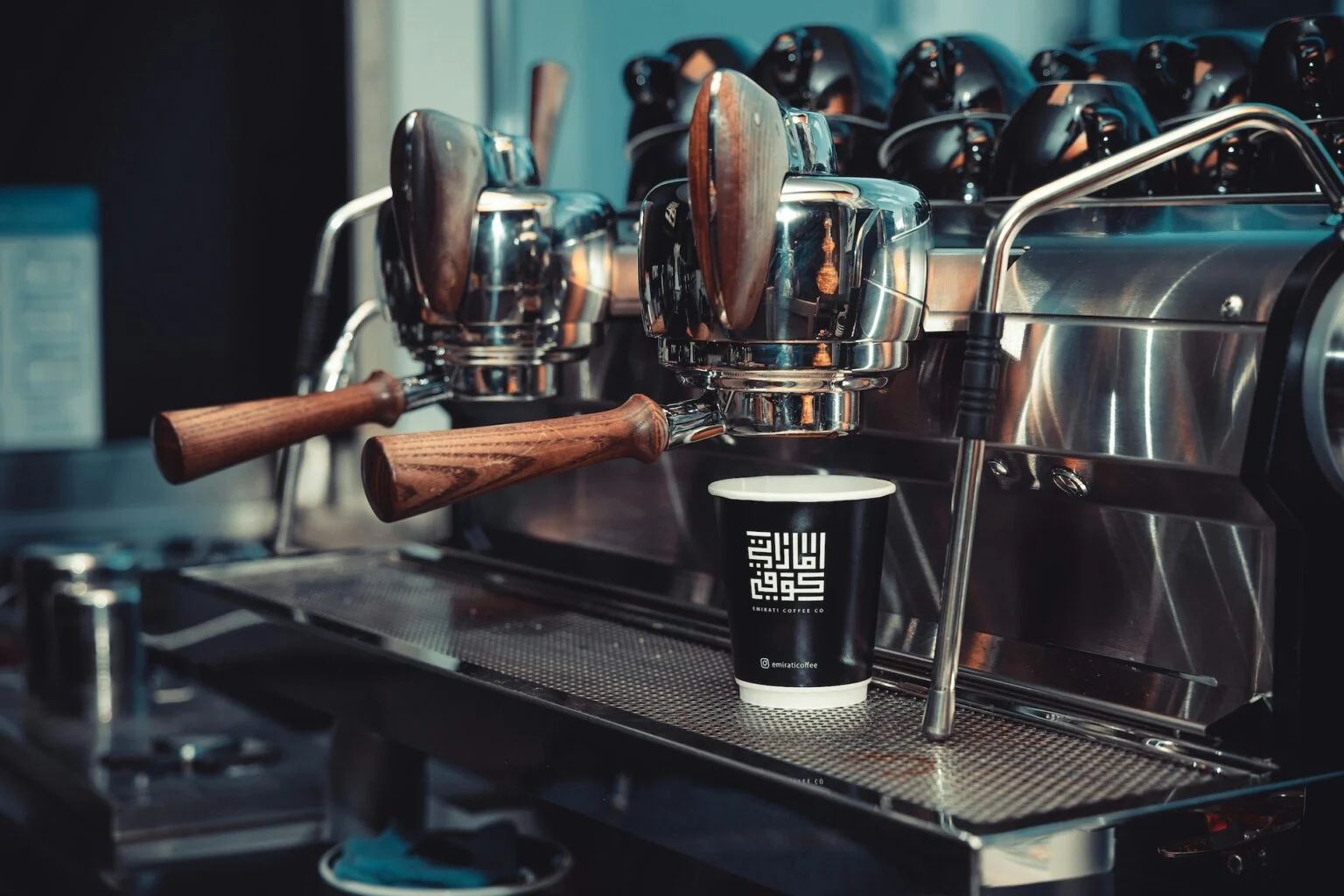 Professional coffee machine preparing espresso in cafe with digital signage marketing concept