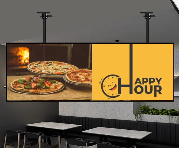Happy hour digital signage in restaurant promoting pizza deals and food offers