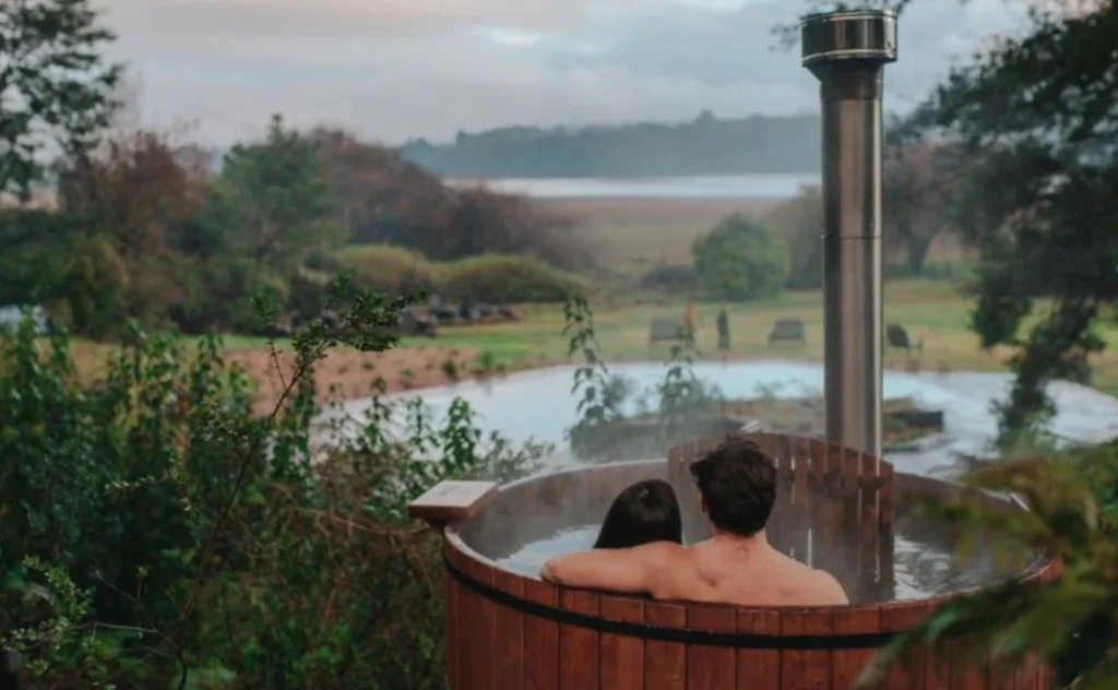Hotel guests relaxing In hot tub